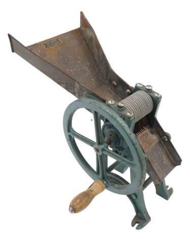 A Nye & Co of London cast iron table top pasta shredder, with retailers label for Retinners & Coppersmiths Kitchen Equipment, Dean Street, London, 39cm high.