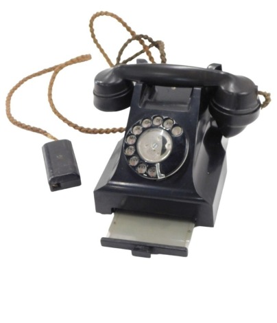 A GPO 330CB black Bakelite telephone, index slide.