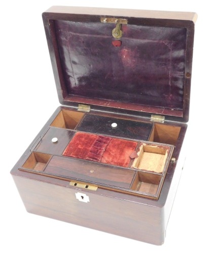 A Victorian rosewood work box, with hinged lid in mother of pearl plaque, and mother of pearl key escutcheon, the interior fitted with numerous divisions, pin cushion, and with secret drawer, 15cm high, 27cm wide, 20cm deep.