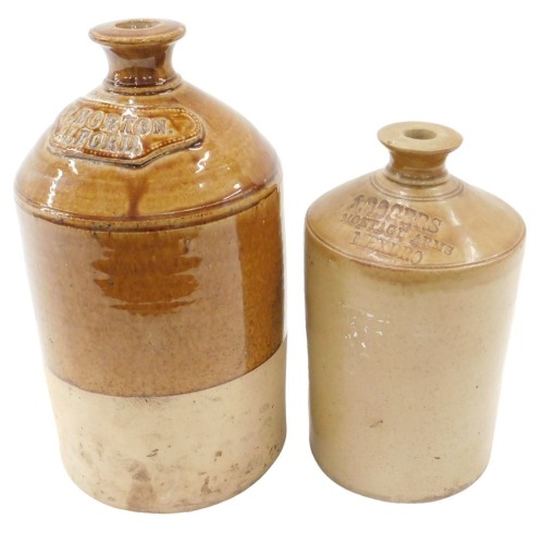 Two stoneware flagons, including one partially treacle glazed flagon for W Morton Alford, 33cm high, and another for J Rogers Montagu Arms Mexbro, 25cm high.