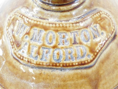 Two stoneware flagons, including one partially treacle glazed flagon for W Morton Alford, 33cm high, and another for J Rogers Montagu Arms Mexbro, 25cm high. - 2