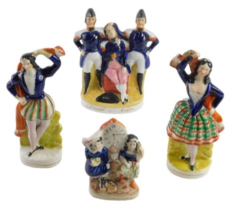 A group of Victorian Staffordshire flat back figures, comprising a group entitled Death of Nelson, 23cm high, two Highland dancers, 23.5cm and 24cm high, and a small clock group with two children, 15cm high. (4)