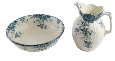 Staffordshire pottery jug and bowl set, with transfer printed trailing flower head and foliage designs in blue, back stamp, marks with crown and Stoke Pottery, 30cm high, bowl measures 37cm diameter.