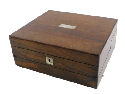 A Victorian rosewood travelling work box and writing slope, with mother of pearl inlay to the lid and key escutcheon, the interior with fitted compartments and silk lining, including an agate mounted pin cushion, the writing slope with plush lining and tw