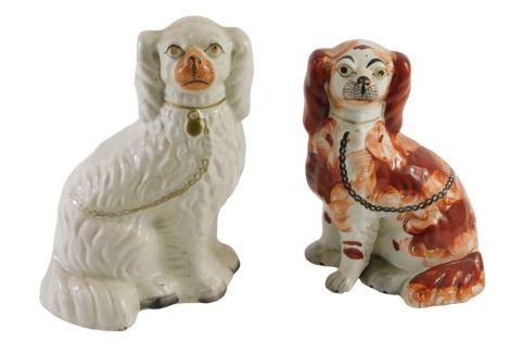 Two Staffordshire comforter dog Spaniels, the King Charles with freestanding front leg, 26.5cm x 24cm.