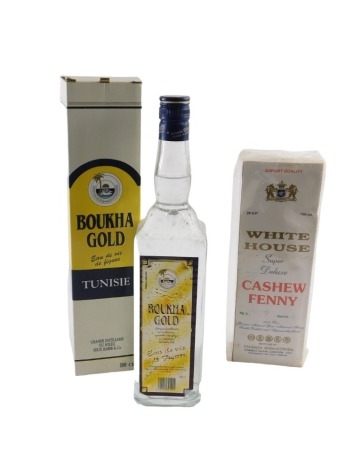 A bottle of Boukha Gold and a bottle of White House Cashew Fenny, 100cl and 750ml respectively, both boxed.