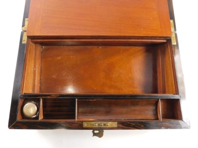 A Victorian oak veneered writing slope, with fitted interior, having blue leather gilt tooled writing pad, one ink bottle, with brass presentation cartouche with inset brass shield shaped plaque to the lid, inscribed James WM Glover from HSS, 14th August - 4