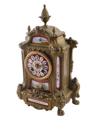 A 20thC mantel clock, in gilt metal case, inset with porcelain plaques, the dial with Roman numerals, and with eight day striking French movement, raised on claw feet, with pendulum and key, 35cm high. (AF)