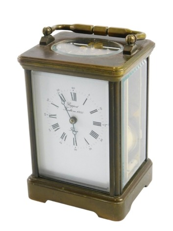 A brass cased carriage clock signed Rapport, with white enamel dial, inscribed Rapport Fondee En 1900, with eight day movement, striking on the gong, with visible escapement to the fore plate case, 17.5cm handle up, with key.