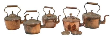 Five copper kettles.