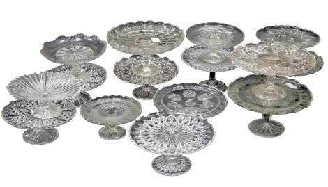 A group of various pressed glass cake stands. (15)