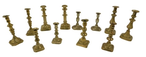 Six pairs of various 19thC brass candlesticks, various sizes.