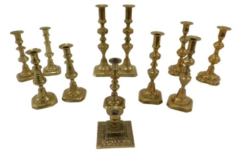 19thC brass candlesticks, including four pairs and four odd candlesticks, various sizes.