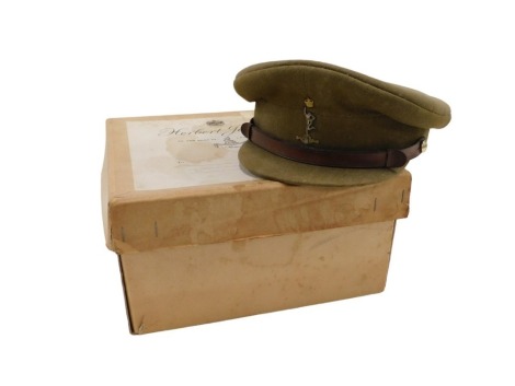 An officer's khaki dress cap, for The Royal Corp of Signals, with leather band, the interior with dymo printed name label for Major JM Newman, with original cardboard box for Herbert Johnson, New Bond Street London.