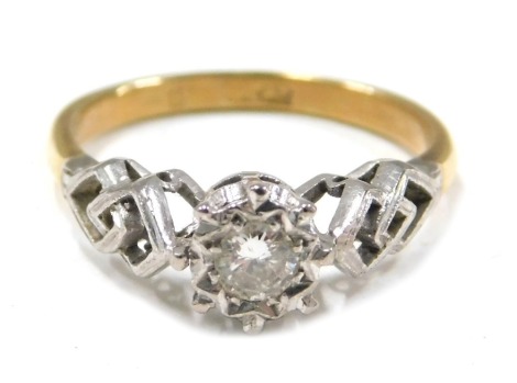 A diamond set dress ring, the round brilliant cut diamond approx 0.10ct, in a claw star setting, with interwoven shoulders, on white gold, on a yellow metal band unmarked, ring size J½, 2.3g all in.