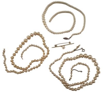 Cultured pearl and other jewellery, comprising a 9ct gold pearl set single pin brooch, 4.5cm wide, and two cultured pearl necklaces, with plated clasps. (3)