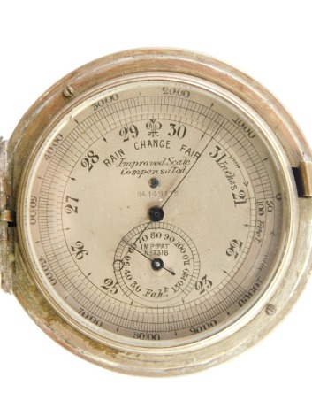 An imperial scale compensated silver cased barometer/altometer, with blue hands and centre dial, with partial UK hallmarks, 105.8g all in.