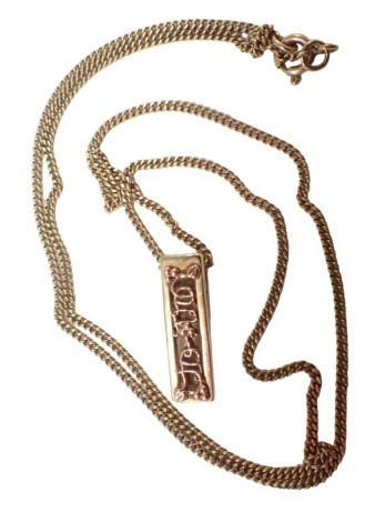 A Glogau pendant and chain, the pendant showing vine decoration in rose and yellow gold colouring, unmarked, 2cm high, on a flattened curb neck chain, yellow metal, clasp stamped 375, 50cm long, 6.1g all in, boxed.