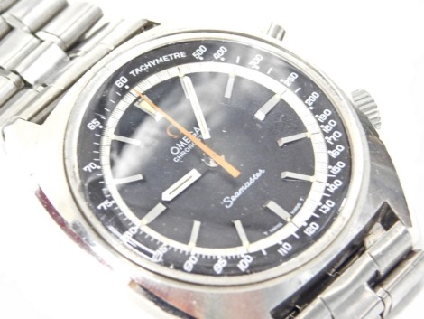 An Omega Seamaster chronostop gentleman's wristwatch, with a black face, tachymetre outer dial, with orange seconds dial, in stainless steel case and strap, with additional black leather strap, in fitted case, with instructions, the dial 3.5cm diameter.