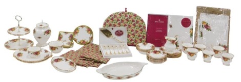 A selection of Royal Albert Old Country Roses tea ware and accessories, comprising six cups and ten saucers in two sizes, tea plates, bread and butter plates, oval serving dish, tea cosy, mats, napkins, etc.