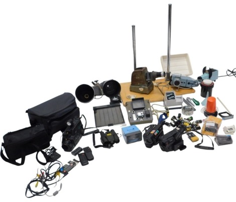 An assortment of video and camera equipment, including two camcorders, a Hanimette slide projector, spot lamps, Aldis projector, etc. WARNING! This lot contains untested or unsafe electrical items. It is supplied for scrap or re-conditioning only. TRADE 