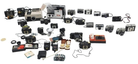 Various cameras, including a Praktica Super TL SLR, a Taron SLR with ever ready case, and other cameras by Ilford, Kodak, including Polaroid cameras, etc. (2 boxes) WARNING! This lot contains untested or unsafe electrical items. It is supplied for scrap 