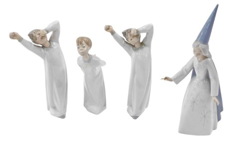 Four Lladro figures, comprising two boy awakening figures, fairy godmother, and another. (4)