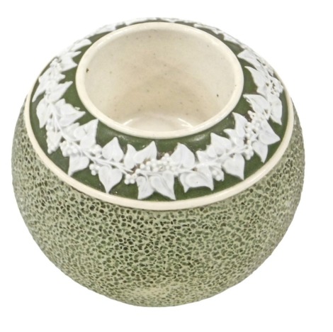 A green Carltonware Jasper style match striker, with a border of fruiting vine decoration to the spherical body, 6cm high.