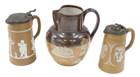 Two Staffordshire lidded stoneware Jasper style relief moulded jugs, one with classical muses, the other with fruiting vine and harvest motifs, 19cm high, and 16cm high respectively, and a Doulton stoneware jug, with hunting and toping scenes, 20cm high. 