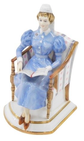 A Royal Worcester porcelain figure of Sister of The London Hospital, modelled by Ruth Van Ruyckevelt, circa 1963, model number 399/500, in fitted case, 17cm high.