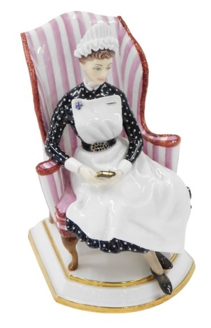 A Royal Worcester porcelain figure of Sister of St Thomas' Hospital, modelled by Ruth Van Ruyckevelt, circa 1963, model number 403/500, with certificate, in fitted case, 16.5cm high.