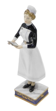 A Royal Worcester porcelain figure of a Sister of University College Hospital, modelled by Ruth Van Ruyckevelt, circa 1965, model number 252/500, with certificate, in fitted case, 22cm high.