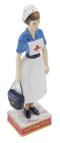 A Royal Worcester porcelain figure of a British Red Cross Society VAD member, modelled by Ronald Van Ruyckevelt, circa 1969, model number 190/750, with certificate, in fitted case, 21.5cm high