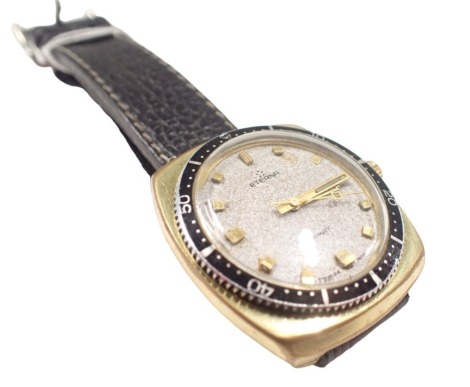 An Eterna automatic gent's wristwatch, with a silvered and batoned dial, with date aperture, in electroplated outer case, on stainless steel back, with black leather strap, 3cm dial.