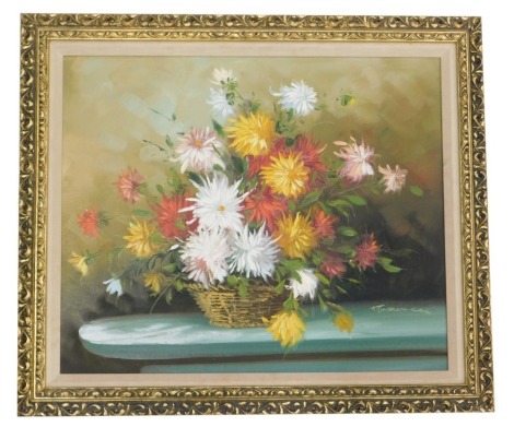 Robert Cox. Study of mixed daily of flowers in a basket, on a ledge, oil on canvas, signed, 50cm x 59cm.