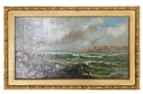 HE Heitland. Coastal scene with rocky foreshore and sailing ships, cliffs beyond, oil on canvas, signed and dated 1901, 24cm x 44cm.