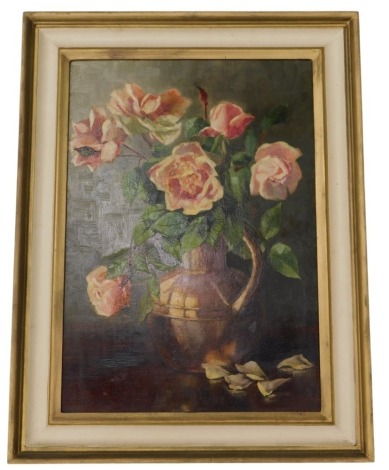 Early 20thC English School. Still life study of roses in a copper pot, oil on mahogany panel, 50cm x 35cm.