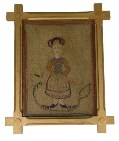 A needlework picture, of a girl in traditional dress, 45cm x 34cm, in Oxford style frame.