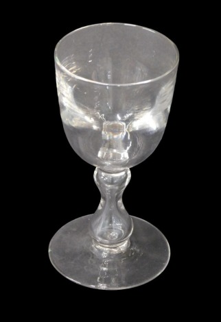 A 19thC wine glass, with plain bucket shaped bowl, and hour glass bubble stem, with plain foot, 12cm high.