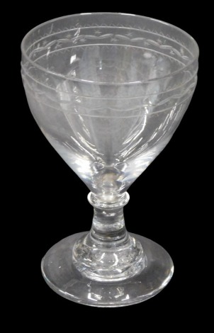 A 19thC rummer glass, with delicate engraved border, tapered stem and spreading foot, with pontil mark.