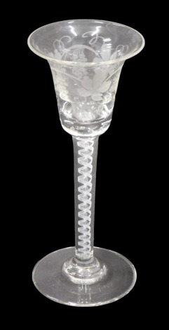 A 19thC style wine glass, flared bowl engraved with fruiting vine decoration, and with opaque air twist stem, 15.5cm high.