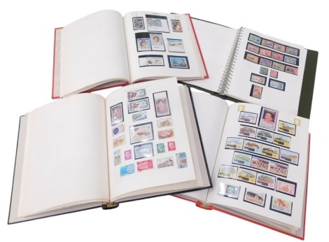 Four albums of French and Portuguese stamps, including French early 1900s, including French Empire (Napoleon III), French empire and later definitives and commemoratives, and French colonies, including equatorial Africa, Central Africa, French Guinea, Fre