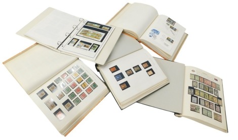 Five stamp albums, including United States, Canada and New Zealand, Australia and states, some facsimiles included.