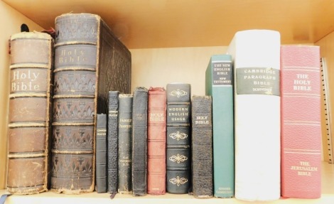 Holy Bible and common prayer books, comprising a brass bound and enamelled bible dated 1840, and a further leather tooled bible, undated but 19thC, and various other more modern Holy bible and common prayer books. (1 shelf)