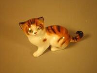 A Royal Doulton porcelain tortoiseshell cat HN2584