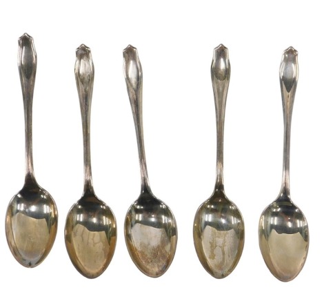 A cased part set of five George V silver teaspoons, each with a shaped top, maker JDWD, Sheffield 1932, 1.72oz, in fitted case.