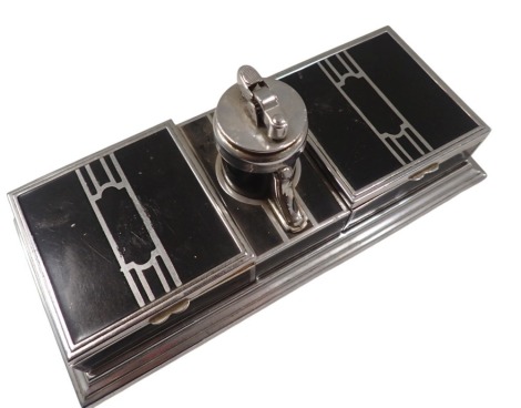 A Ronson Art Deco table lighter, formed with two square sections, cigarette box, centred by lighter, on black enamel and chrome ground, 23cm wide, 10cm high, 9cm deep.