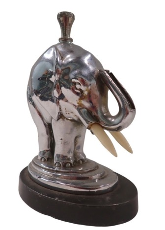 A 1950s/60s chrome table lighter, formed as an elephant on circular foot, stamped AMV Works 1935, 12cm high, 9cm diameter.