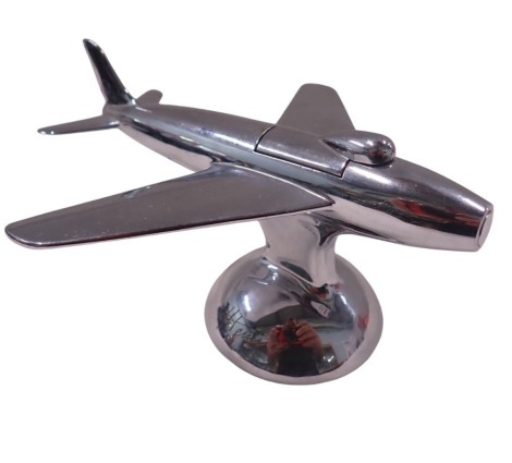 A Dunhill table lighter, in the form of an airplane, signed J Hennick, 9cm high, 16cm wide.