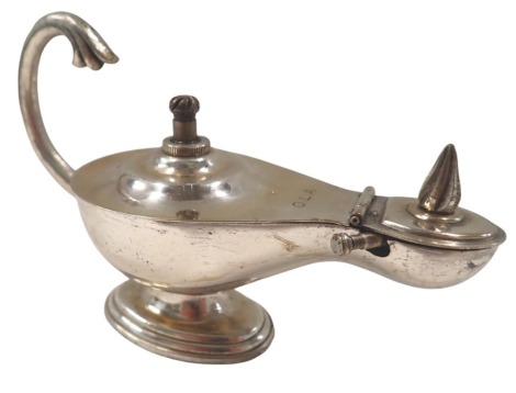 A Dunhill London Aladdin's lamp table lighter, inscribed OLA, 11cm high, 14cm wide, 6cm deep.